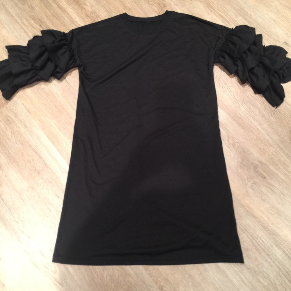 Lots of ruffles Ruffled sleeves dress. modest.